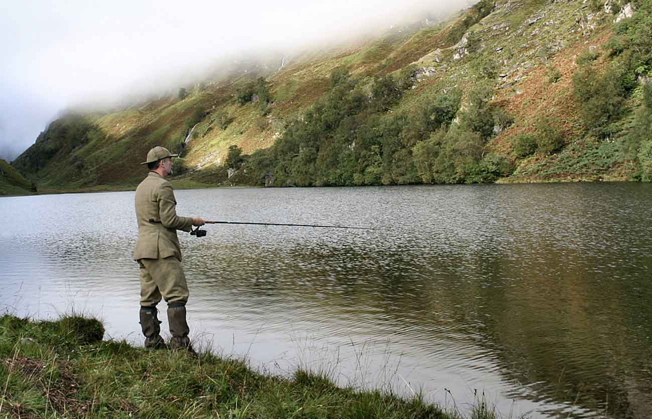 Fishing the lochan at Glen Pean, Glen Dessary Estate, with mist on the hillside