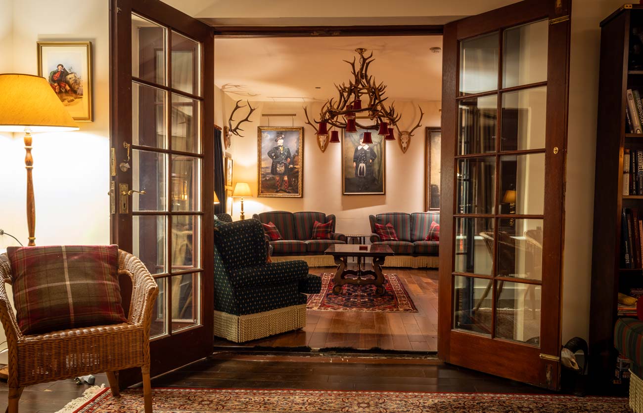 Glazed doors opening into the drawing room at Glen Dessary Lodge